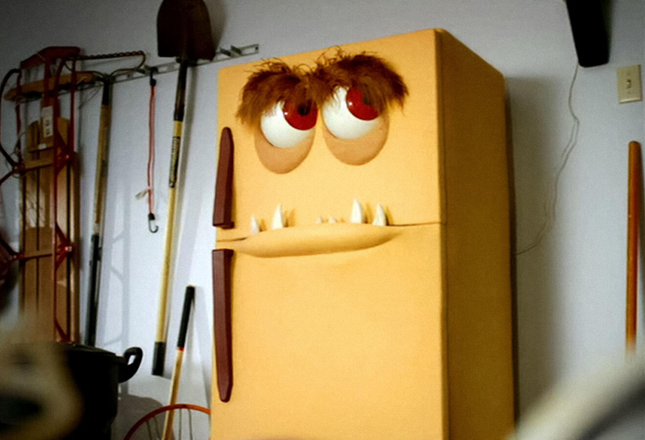 Yellow animatronic refrigerator puppet. An odd one!